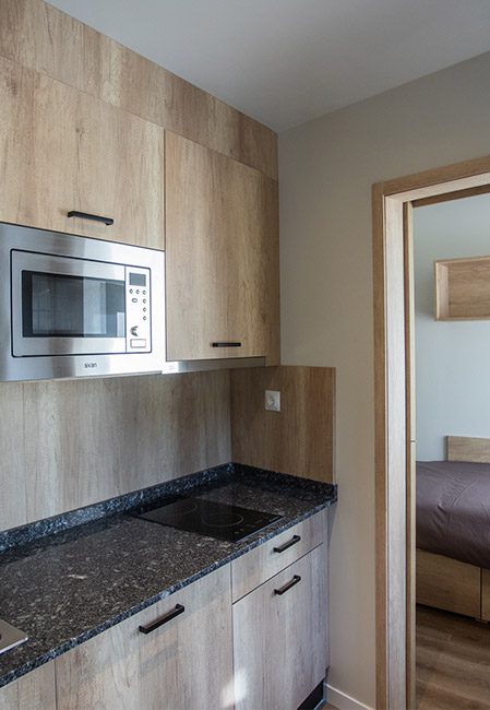 Habitación individual con cocina compartida detalle cocina
